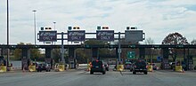 A toll plaza with E-ZPass lanes in Bensalem Township, Pennsylvania on the Pennsylvania Turnpike EZ Pass Pennsylvania Bensalem.jpg