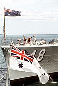 Royal Australian Navy ensign (foreground), Royal Australian Navy jack (background)