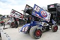 Steve Kinser and Donny Schatz sprint cars in the pits.