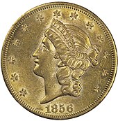 Pièce de monnaie comprenant le profil gauche d'un femme aux cheveux longs, portant un diadème avec l'inscription « Liberty ». Treize étoiles et la date, 1856.