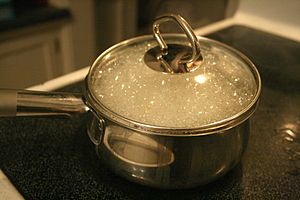 Water boiling in a pot while cooking rotini pa...