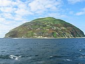 Mountain rising from sea.