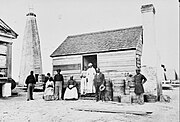 Beacon Tower and "negro cabin", Cockspur Island, Georgia, photographed 1863