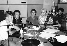 U2 with radio host Dave Fanning (center) in February 1982 Dave and U2 in studio, 1982.jpg