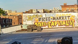 Libertarian socialist mural reading "Free market, anti-capitalist" FreeMarketAntiCapitalist.jpg