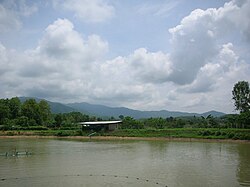 Fishpond in Mae Yao District with the Daen Lao Range in the background