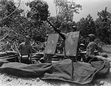 20mm gun crew of the 136th Field Artillery Battalion, 37th Infantry Division, on the lookout for Japanese planes, November 1943. SC 364601 - 20mm gun crew, 136th FA., 37th Div. (52103512614).jpg