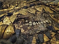 Young attendant from Puabi's death pit, wearing gold headdress and jewelry of gold, lapis lazuli, carnelian, and shell