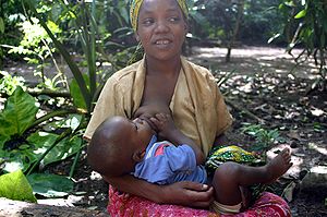 A mother breastfeeding a child at Zanzibar