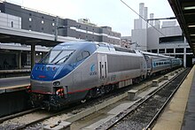 An HHP-8 locomotive and Amfleet I cars in Acela Regional branding at South Station in Boston, in March 2002 Acela Regional in Boston South Station.jpg