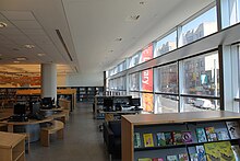 View of the second floor children's library with curtain wall and light shelf Bronx Library Center second floor interior.jpg