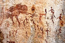 Ancient cave painting showing the primitive communist mode of production Charewa Mythical hunt scene.jpg