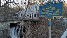 a picture of the marker with the waterfall that powered it in the background