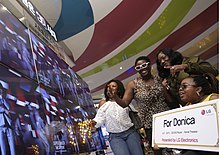 Donika Sterling, an American K-Pop fan diagnosed with Charcot-Marie-Tooth disease, was sponsored to meet her favorite idols in South Korea. Fan watching a k-pop video.jpg