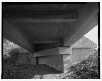 Looking east under the bridge from close to the east side the east abutment is seen