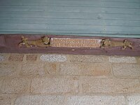 Inscription donnant le nom du recteur à l'origine de la reconstruction de l'église.