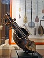 Three quarters view of an elaborate old string instrument.