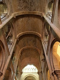 Barrel vault of the central nave supported by round arches.