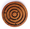 Image 8A ball-in-a-maze puzzle (from List of wooden toys)