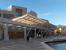 The public entrance of the distinctive Scottish Parliament building, opened in October 2004 ScottishParliamentFront.JPG