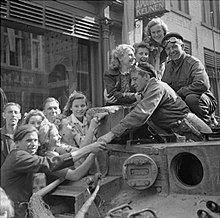 The crew of a Cromwell tank is welcomed by Dutch civilians in Eindhoven, 19 September 1944. The British Army in North-west Europe 1944-45 BU950.jpg