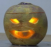 A Jack-o'-lantern carved from a turnip.