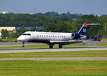 An Air Wisconsin (d/b/a US Airways Express) CRJ200 landing at Portland International Jetport UsairwaysN419aw 07302009.jpg