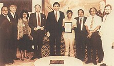 U.S. Ambassador to Indonesia Paul Wolfowitz and USAID Mission Director David Merrill presented a plaque to Suardi Sumadiwangsa, the 10,000th Indonesian to participate in USAID's Overseas Training Program in 1987. 10,000th Participant (39770440515).jpg