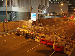 Barricade reinforced with bamboo scaffolds in front of PLA building