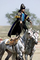 A Kazakhstani performer demonstrates the long equestrian heritage as part of the gala concert during the opening ceremonies of the Central Asian Peacekeeping Battalion. Equestrian heritage, Kazakhstan.JPEG