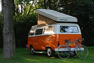 Orange-White Volkswagen T2 Camper Van with ope...