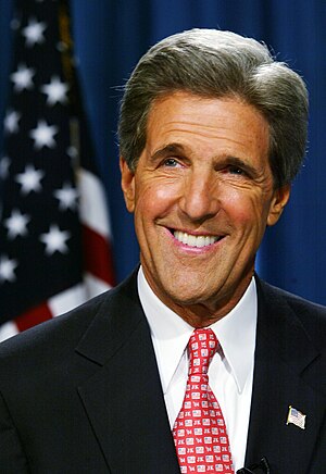 Headshot of John Kerry with the U.S. flag in t...