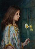 Young girl holding daffodils