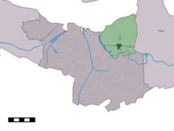 The village centre (dark green) and the statistical district (light green) of Zaamslag in the municipality of Terneuzen.