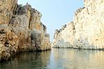 River flowing through a gorge with white marble stones