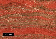 Magnified view of banded iron formation specimen from Upper Michigan. Scale bar is 5.0 mm. MichiganBIF.jpg