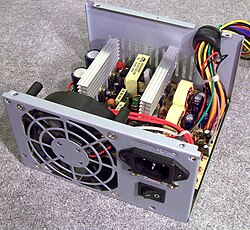 The top cover has been removed to show the internals of a computer Power supply Unit.