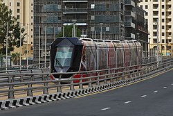 A tram with a Chili’s advertisement at Dubai Marina.