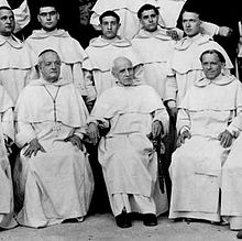 Hyacinthe-Marie Cormier, seated in the middle. To his right sits Pio Alberto Del Corona, the Bishop of San Miniato. Blessed Hyacinthe Cormier OP.jpg