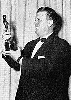 George Stevens holding his Oscar for Giant.