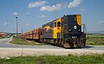 Former JZ class 661, now Kosovo Railways 003, with an empty NewCoFerronikeli ore train on its way to the Golesh mine near Prishtinë airport in July 2009