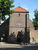 Sint-Ritakerk, een brede basilicale Rooms-katholieke kerk in traditionalistische bouwstijl, oorlogsschade door bombardement in 1943 hersteld in 1946-1947