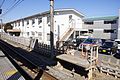 The driver changeover platform for up services and the staff dormitory block next to the station in February 2012