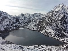 Frozen Gosaikunda Lake in winter.