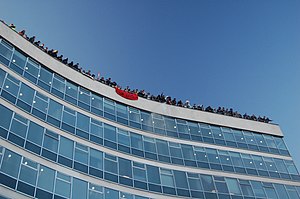 Protesters on the roof of 30 Millbank Rooftop protest at 30 Millbank.jpg
