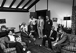 A 1978 meeting at Camp David with (seated, l-r) Aharon Barak, Menachem Begin, Anwar Sadat, and Ezer Weizman. Sadat and Begin and their delegations at Camp David, September 17, 1978 (10729645586).jpg