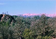 mixed evergreen forest in the foreground with Sanhedrin Mountains in the Mendocino Range in the distance