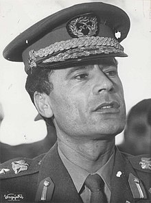 When the Strasserite faction took control of the National Front in the 1980s, it based its views of a future government on the ideas in The Green Book of Muammar Gaddafi (pictured). Stevan Kragujevic, Moamer el Gadafi u Beogradu.jpg