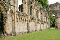 St Mary's Abbey was founded in 1155 and destroyed during the Dissolution, c. 1539. Wall of the ruins, st marys abbey York 8714.jpg