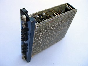 A CDC 6600 cordwood logic module containing 64 silicon transistors. The coaxial connectors are test points. The module is cooled conductively via the front panel. The 6600 model contained nearly 6,000 such modules. CDCcordwood1.jpg
